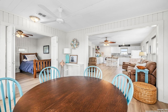 902 Harrison Prt, Oconnor, TX 77982 - dining area with a ceiling fan and light wood finished floors