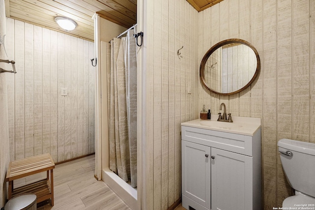902 Harrison Prt, Oconnor, TX 77982 - full bathroom with wood finished floors, vanity, and a shower with curtain
