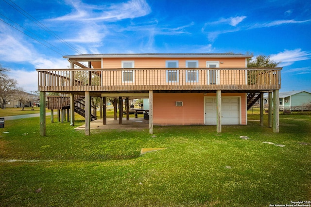 902 Harrison Prt, Oconnor, TX 77982 - rear view of house featuring stairway, a wooden deck, and a yard