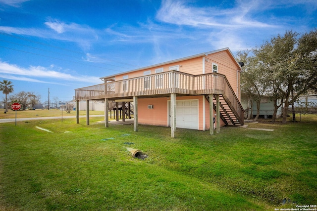 902 Harrison Prt, Oconnor, TX 77982 - back of house with stairs, a wooden deck, a lawn, and an attached garage
