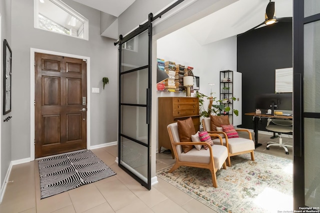 2102 Encino Clf, San Antonio, TX 78259 - foyer with a barn door, a towering ceiling, ceiling fan, and tile patterned floors