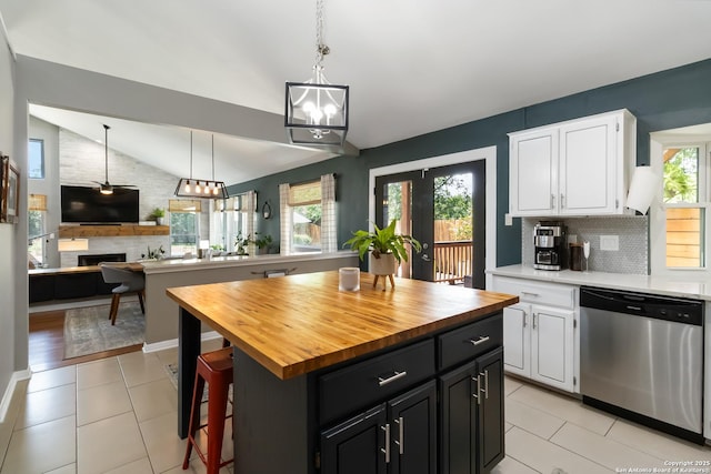 2102 Encino Clf, San Antonio, TX 78259 - kitchen with stainless steel dishwasher, butcher block countertops, plenty of natural light, and lofted ceiling