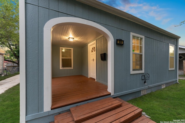 1806 W Mistletoe Ave, San Antonio, TX 78201 - view of exterior entry with a lawn and crawl space