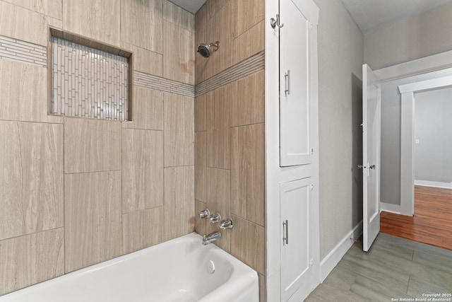 1806 W Mistletoe Ave, San Antonio, TX 78201 - bathroom featuring bathing tub / shower combination and baseboards