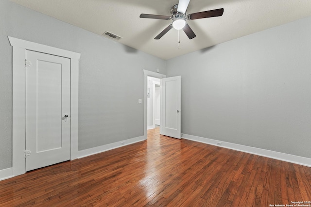 1806 W Mistletoe Ave, San Antonio, TX 78201 - unfurnished bedroom featuring wood-type flooring and ceiling fan
