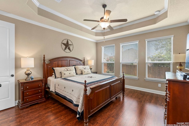 25926 Natal Plum, San Antonio, TX 78261 - bedroom featuring a raised ceiling, dark wood-style flooring, ornamental molding, and a ceiling fan