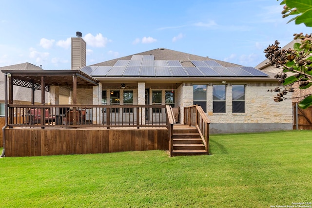 25926 Natal Plum, San Antonio, TX 78261 - back of house featuring a yard, solar panels, a chimney, and stone siding