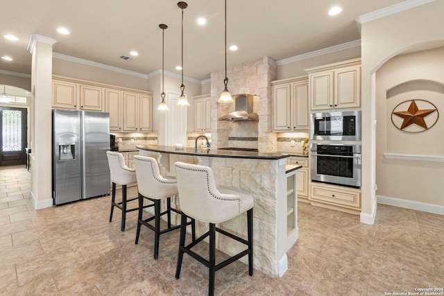 25926 Natal Plum, San Antonio, TX 78261 - kitchen with stainless steel appliances, cream cabinets, wall chimney range hood, ornamental molding, and decorative backsplash