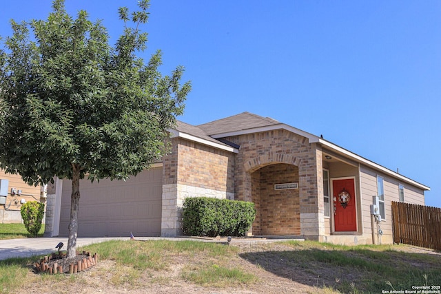 11334 Pink Star, San Antonio, TX 78245 - view of front of property with a garage, concrete driveway, and brick siding