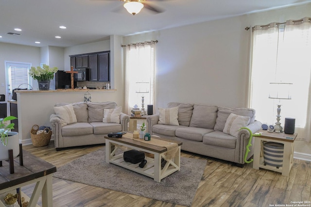 11334 Pink Star, San Antonio, TX 78245 - living area featuring healthy amount of natural light, light wood finished floors, ceiling fan, and recessed lighting