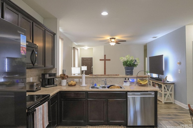 11334 Pink Star, San Antonio, TX 78245 - kitchen featuring black appliances, a peninsula, ceiling fan, light countertops, and light wood-style floors