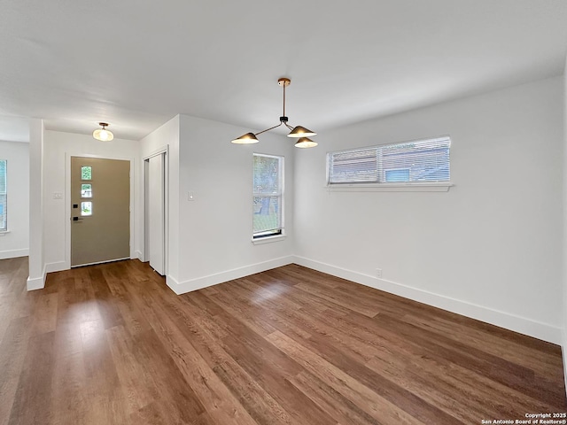 543 Cosgrove, San Antonio, TX 78210 - empty room with baseboards and wood finished floors