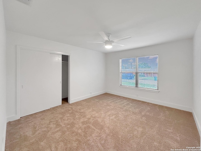543 Cosgrove, San Antonio, TX 78210 - unfurnished bedroom with light colored carpet, a closet, and a ceiling fan