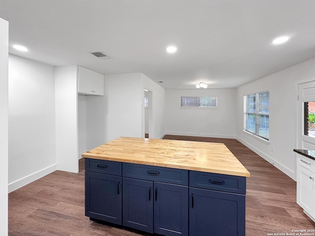 543 Cosgrove, San Antonio, TX 78210 - kitchen with wooden counters, recessed lighting, dark wood-style flooring, blue cabinets, and white cabinetry