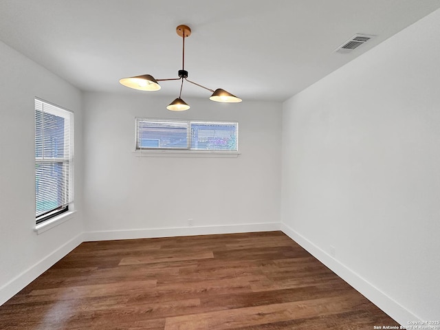 543 Cosgrove, San Antonio, TX 78210 - unfurnished room featuring wood finished floors and baseboards