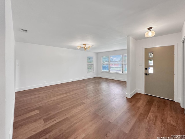 543 Cosgrove, San Antonio, TX 78210 - entrance foyer featuring a chandelier and dark wood-style flooring