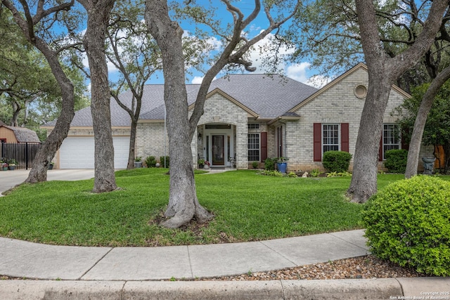 8526 Spartan Ter, Universal City, TX 78148 - view of front of property featuring brick siding, driveway, a shingled roof, and a garage