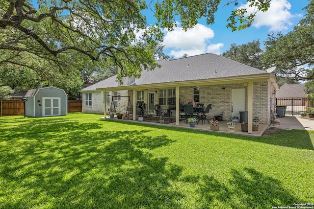 8526 Spartan Ter, Universal City, TX 78148 - back of property with a shed, a patio area, a fenced backyard, and brick siding