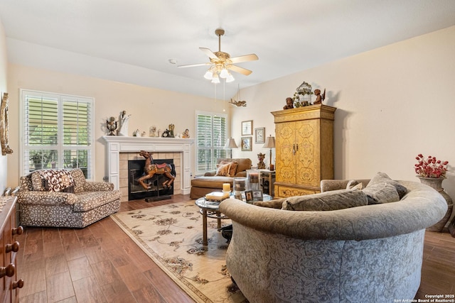 8526 Spartan Ter, Universal City, TX 78148 - living room featuring ceiling fan, dark wood finished floors, and a tiled fireplace