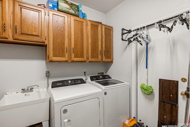 8526 Spartan Ter, Universal City, TX 78148 - laundry area with cabinet space and washing machine and clothes dryer