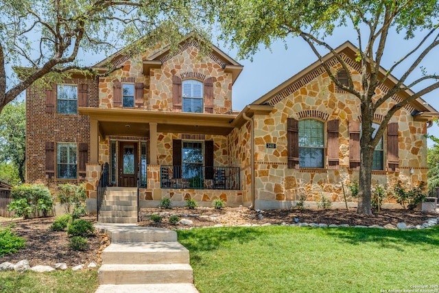 3415 Crest Noche Dr, San Antonio, TX 78261 - view of front of home featuring stone siding, covered porch, and a front yard