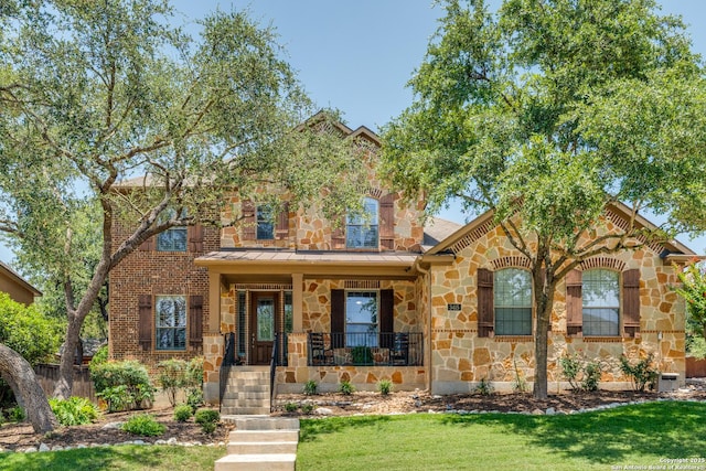 3415 Crest Noche Dr, San Antonio, TX 78261 - view of front of house with stone siding, covered porch, and a standing seam roof