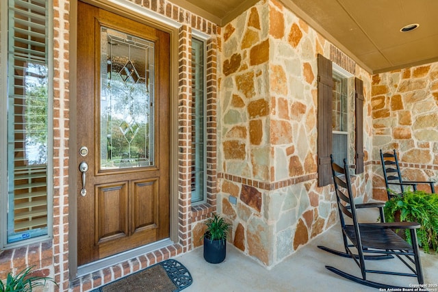 3415 Crest Noche Dr, San Antonio, TX 78261 - property entrance with a porch and stone siding