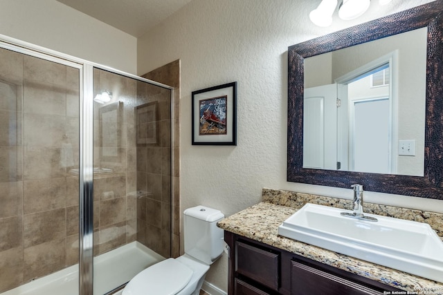 3415 Crest Noche Dr, San Antonio, TX 78261 - full bathroom with vanity, a textured wall, and a shower stall