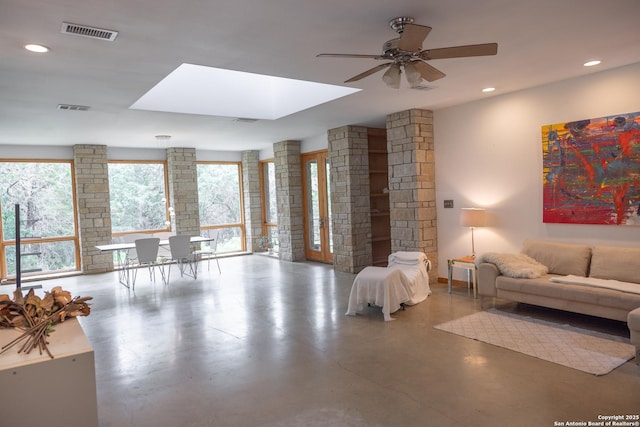 317 Saddle Mtn, Boerne, TX 78006 - living room featuring a ceiling fan, recessed lighting, a skylight, and concrete floors