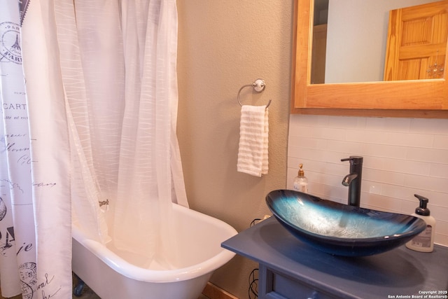 317 Saddle Mtn, Boerne, TX 78006 - full bathroom with decorative backsplash and a textured wall