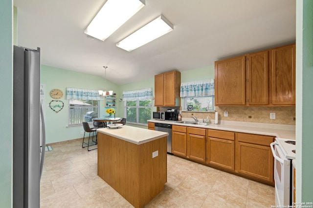 5327 Stormy Skies, San Antonio, TX 78247 - kitchen featuring stainless steel appliances, a kitchen island, tasteful backsplash, light countertops, and brown cabinetry