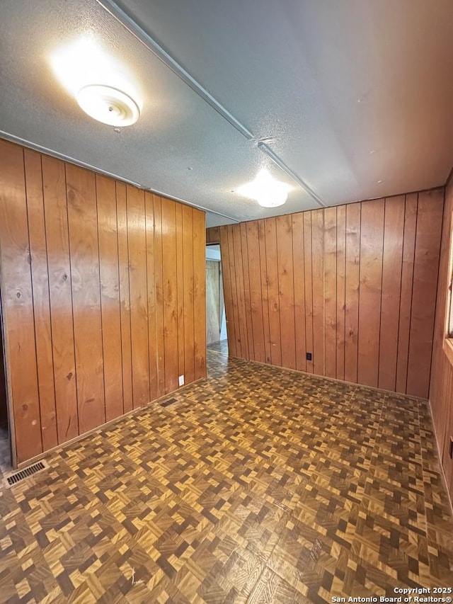 323 N Scenic Loop, Canyon Lake, TX 78133 - finished basement with wood walls and a textured ceiling