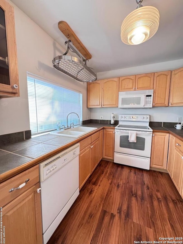 323 N Scenic Loop, Canyon Lake, TX 78133 - kitchen featuring white appliances, light brown cabinets, dark wood-style floors, and dark countertops