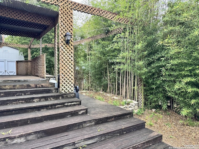 323 N Scenic Loop, Canyon Lake, TX 78133 - wooden deck featuring a storage unit