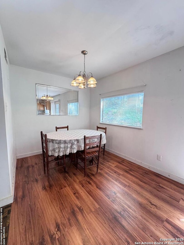 323 N Scenic Loop, Canyon Lake, TX 78133 - dining room featuring a chandelier and wood finished floors