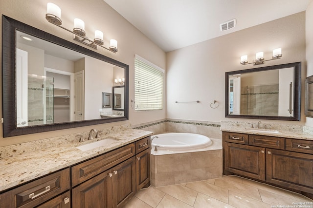 1702 Terra Alta, San Antonio, TX 78209 - bathroom with tile patterned floors, a shower stall, two vanities, and a garden tub