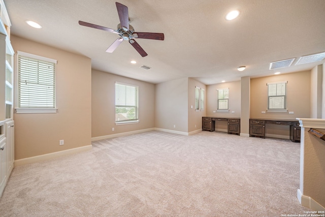 1702 Terra Alta, San Antonio, TX 78209 - unfurnished room with ceiling fan, built in desk, light carpet, healthy amount of natural light, and recessed lighting