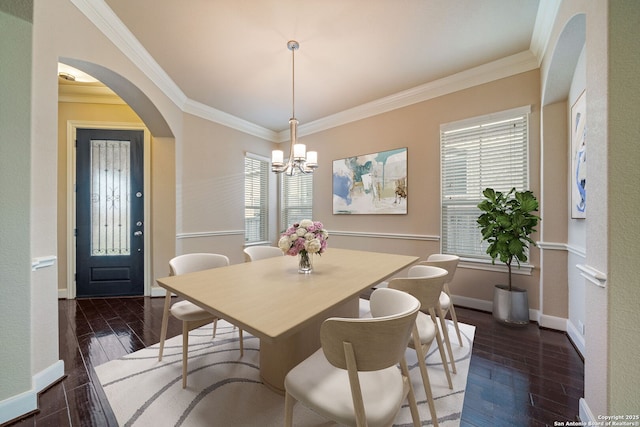 1702 Terra Alta, San Antonio, TX 78209 - dining space featuring crown molding, a chandelier, wood-type flooring, and arched walkways