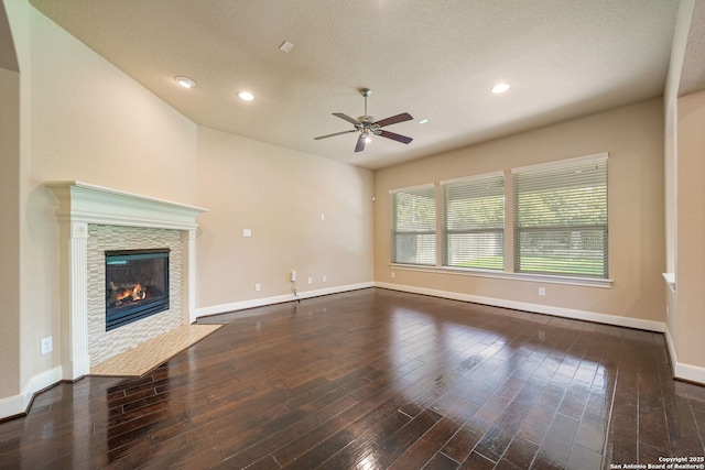 1702 Terra Alta, San Antonio, TX 78209 - unfurnished living room with a ceiling fan, hardwood / wood-style flooring, a fireplace, and recessed lighting