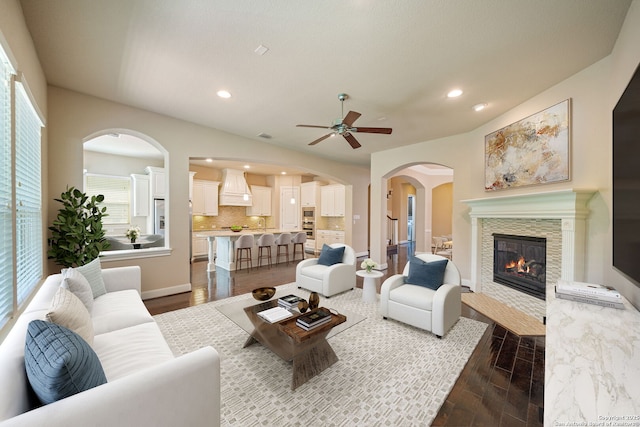 1702 Terra Alta, San Antonio, TX 78209 - living area with a ceiling fan, a glass covered fireplace, dark wood finished floors, recessed lighting, and arched walkways