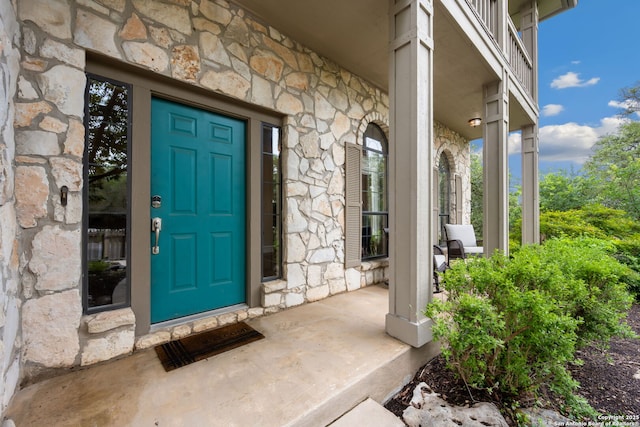 7 Mcinnis, Bulverde, TX 78163 - view of exterior entry featuring stone siding and a porch