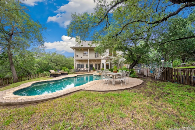 7 Mcinnis, Bulverde, TX 78163 - rear view of property with a balcony, a fenced backyard, and a patio area