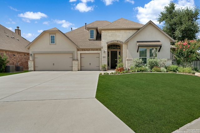 8903 Gate Pass, Boerne, TX 78015 - french country inspired facade with stone siding, concrete driveway, a front lawn, an attached garage, and roof with shingles