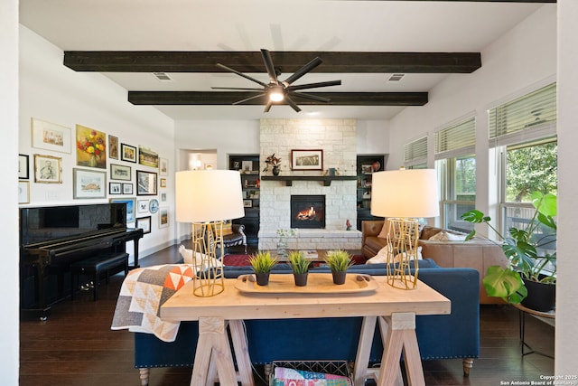 8903 Gate Pass, Boerne, TX 78015 - living room with hardwood / wood-style flooring, beamed ceiling, a ceiling fan, and a stone fireplace
