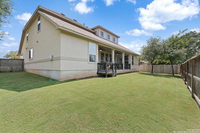 8903 Gate Pass, Boerne, TX 78015 - rear view of property featuring ceiling fan, a fenced backyard, roof with shingles, and stucco siding