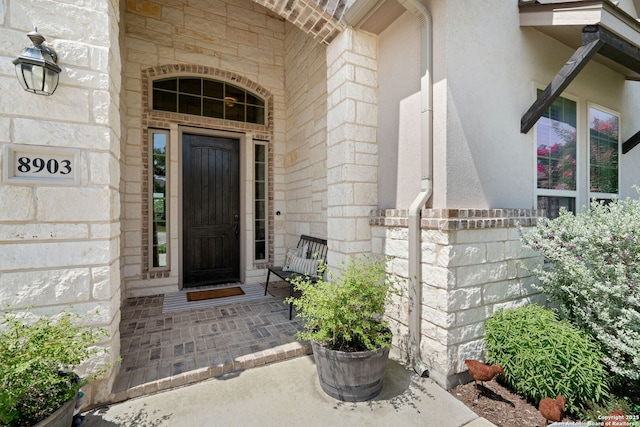 8903 Gate Pass, Boerne, TX 78015 - property entrance with stone siding and covered porch