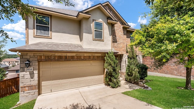24514 Bliss Cyn, San Antonio, TX 78260 - view of front facade with a garage, stucco siding, and driveway