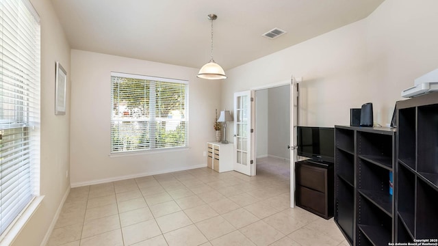 24514 Bliss Cyn, San Antonio, TX 78260 - unfurnished dining area featuring french doors, light tile patterned flooring, and a desk
