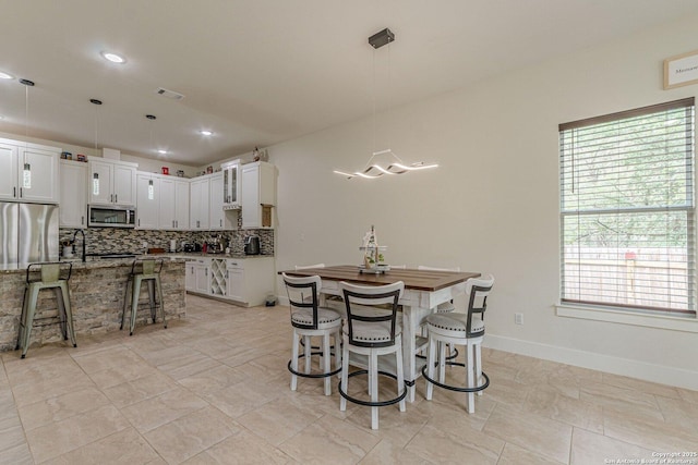 114 Mokukua Ln, Bastrop, TX 78602 - dining space with plenty of natural light and recessed lighting