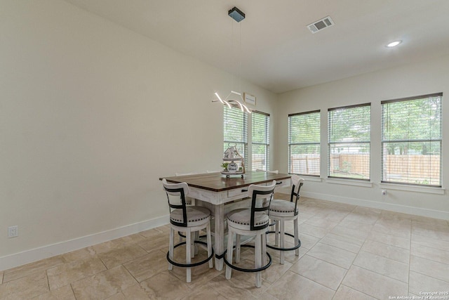 114 Mokukua Ln, Bastrop, TX 78602 - dining room with light tile patterned floors and recessed lighting